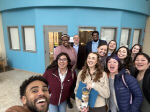 Image of 12 advocates inside the state capitol building in Olympia, Washington, including COO Sunny Wonder and Nneka D. Coxeff.